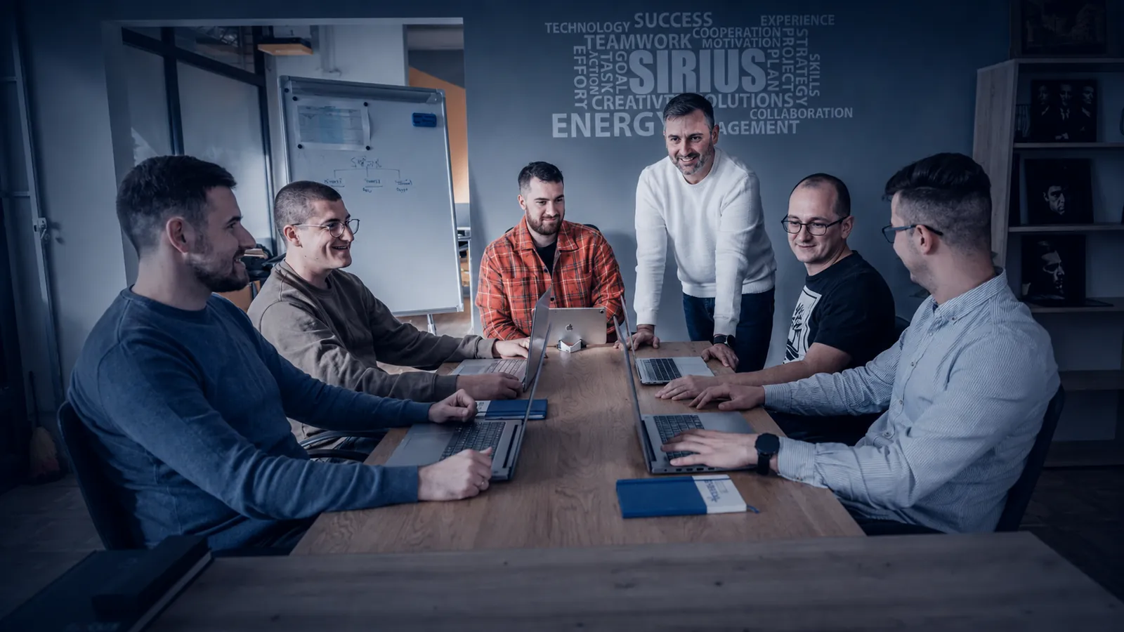 Sirius Solutions team collaborating in the office